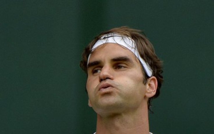 След Уимбълдън, Федерер отиде в Африка да дарява