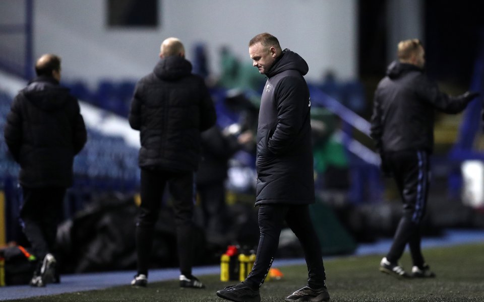 Първият отбор на Дарби Каунти и временният мениджър Уейн Рууни