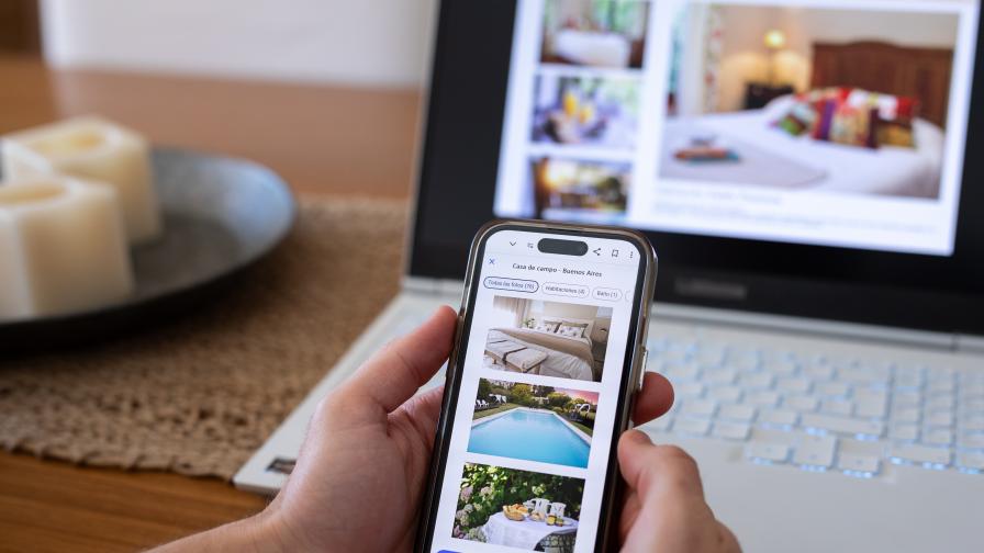 896-504-unrecognizable-person-reviewing-hotels-online-using-smartphone.jpg