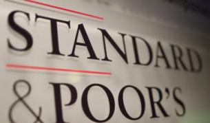 Полиция в офисите на "Стандард енд Пуърс" в Милано