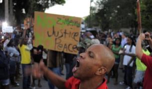 Демонстрантите искат справедливост за Трейвън Мартин, застрелян от бял в Санфорд, Флорида, на 26 февруари
